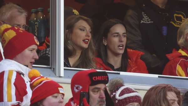 Taylor Swift watches from a suite with basketball player Caitlin Clark, right, during the second half of an NFL football AFC divisional playoff game Saturday, Jan. 18, 2025, in Kansas City, Mo. (AP Photo/Travis Heying)