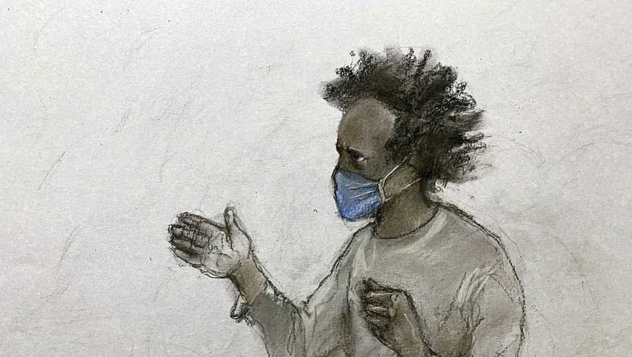 Court artist sketch by Elizabeth Cook of Southport stabbings suspect Axel Rudakubana, 18, shouting from the dock as he appeared at Liverpool Crown Court, for his sentencing hearing after he pleaded guilty to murdering three young girls in a knife attack at a Taylor Swift-themed dance class, in Liverpool, England, Thursday Jan. 23, 2025. (Elizabeth Cook/PA via AP)