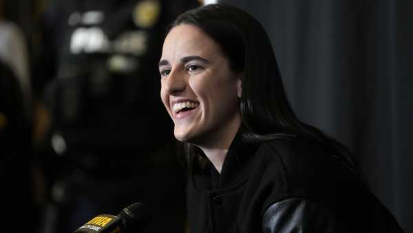 Former Iowa guard and current Indiana Fever WNBA player Caitlin Clark speaks during a news conference before an NCAA college basketball game between Iowa and USC, Sunday, Feb. 2, 2025, in Iowa City, Iowa. (AP Photo/Charlie Neibergall)