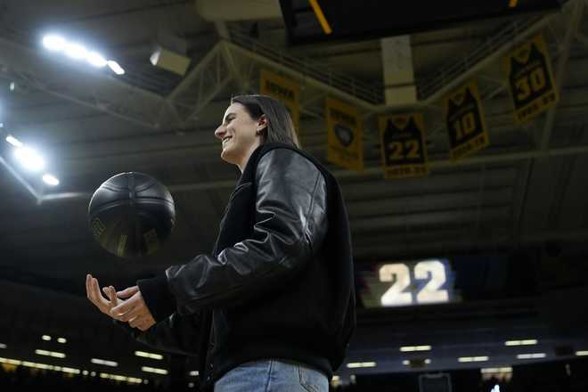 Former&#x20;Iowa&#x20;guard&#x20;and&#x20;current&#x20;Indiana&#x20;Fever&#x20;WNBA&#x20;player&#x20;Caitlin&#x20;Clark&#x20;walks&#x20;on&#x20;the&#x20;court&#x20;during&#x20;her&#x20;jersey&#x20;retirement&#x20;ceremony&#x20;after&#x20;an&#x20;NCAA&#x20;college&#x20;basketball&#x20;game&#x20;between&#x20;Iowa&#x20;and&#x20;Southern&#x20;California,&#x20;Sunday,&#x20;Feb.&#x20;2,&#x20;2025,&#x20;in&#x20;Iowa&#x20;City,&#x20;Iowa.&#x20;&#x28;AP&#x20;Photo&#x2F;Charlie&#x20;Neibergall&#x29;