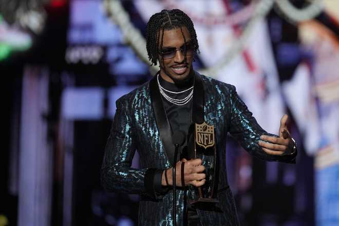 Washington Commanders&apos; Jayden Daniels, AP Offensive rookie of the year speaks during the NFL Honors award show ahead of the Super Bowl 59 football game, Thursday, Feb. 6, 2025, in New Orleans. (AP Photo/David J. Phillip)