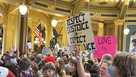 Protesters filled the Iowa state Capitol in Des Moines on Monday, Feb. 24, to denounce a bill that would strip the state civil rights code of protections based on gender identity. (AP Photo/Hannah Fingerhut) 
