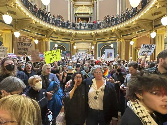 Protesters&#x20;filled&#x20;the&#x20;Iowa&#x20;state&#x20;Capitol&#x20;in&#x20;Des&#x20;Moines&#x20;on&#x20;Monday,&#x20;Feb.&#x20;24,&#x20;2025&#x20;to&#x20;denounce&#x20;a&#x20;bill&#x20;that&#x20;would&#x20;strip&#x20;the&#x20;state&#x20;civil&#x20;rights&#x20;code&#x20;of&#x20;protections&#x20;based&#x20;on&#x20;gender&#x20;identity.&#x20;&#x28;AP&#x20;Photo&#x2F;Hannah&#x20;Fingerhut&#x29;
