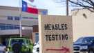 FILE -A sign is seen outside of Seminole Hospital District offering measles testing, Feb. 21, 2025, in Seminole, Texas.