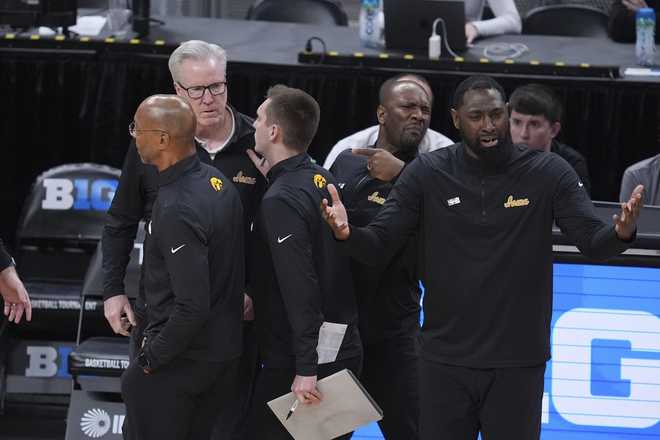 Iowa&#x20;head&#x20;coach&#x20;Fran&#x20;McCaffery,&#x20;back&#x20;left,&#x20;waits&#x20;to&#x20;see&#x20;if&#x20;he&#x20;was&#x20;ejected&#x20;against&#x20;Illinois&#x20;during&#x20;the&#x20;second&#x20;half&#x20;of&#x20;an&#x20;NCAA&#x20;college&#x20;basketball&#x20;game&#x20;in&#x20;the&#x20;second&#x20;round&#x20;of&#x20;the&#x20;Big&#x20;Ten&#x20;Conference&#x20;tournament&#x20;in&#x20;Indianapolis,&#x20;Thursday,&#x20;March&#x20;13,&#x20;2025.&#x20;&#x28;AP&#x20;Photo&#x2F;Michael&#x20;Conroy&#x29;