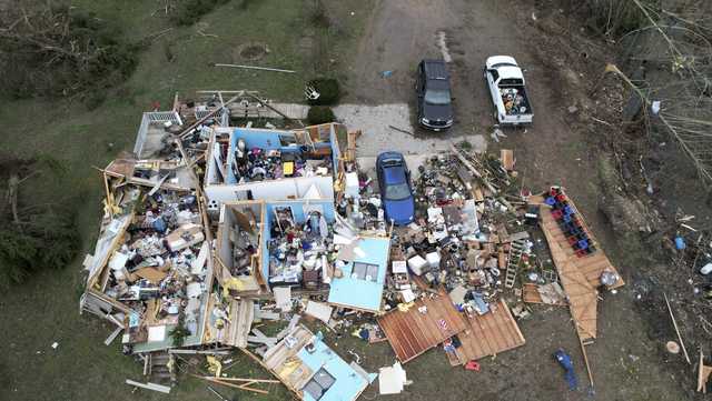 Tornadoes, wildfires and blinding dust sweep across US as storm leaves at least 33 dead