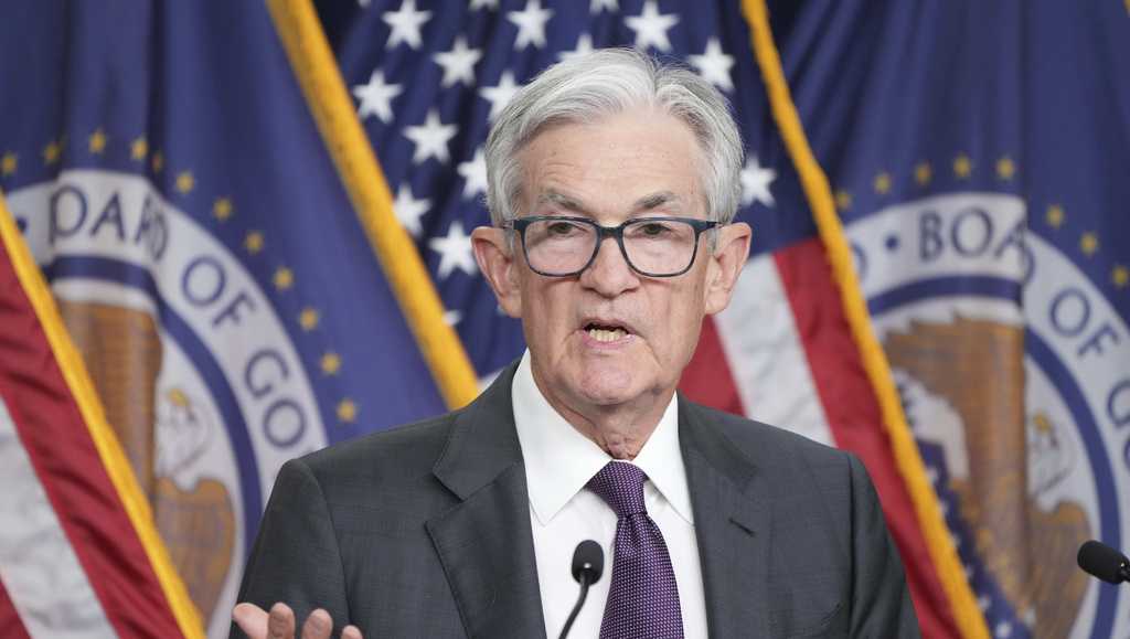 Fed sees tariffs raising inflation this year, keeps key rate unchanged