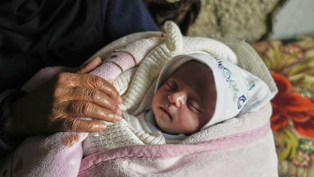 Month-old girl pulled from rubble in Gaza after airstrike killed her ...