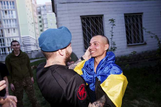 A&#x20;Ukrainian&#x20;soldier&#x20;hugs&#x20;his&#x20;comrade&#x20;after&#x20;returning&#x20;from&#x20;captivity&#x20;in&#x20;a&#x20;POW&#x20;exchange&#x20;in&#x20;Ukraine,&#x20;on&#x20;Saturday,&#x20;April.&#x20;19,&#x20;2025.&#x20;&#x28;AP&#x20;Photo&#x2F;Evgeniy&#x20;Maloletka&#x29;