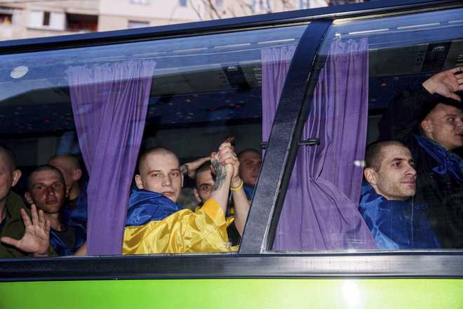 Ukrainian&#x20;servicemen&#x20;ride&#x20;in&#x20;a&#x20;bus&#x20;after&#x20;returning&#x20;from&#x20;captivity&#x20;in&#x20;a&#x20;POW&#x20;exchange&#x20;in&#x20;Ukraine,&#x20;on&#x20;Saturday,&#x20;April.&#x20;19,&#x20;2025.&#x20;&#x28;AP&#x20;Photo&#x2F;Evgeniy&#x20;Maloletka&#x29;