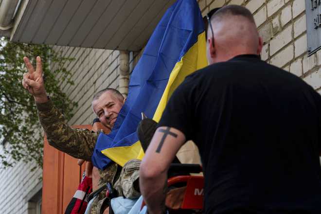 An&#x20;injured&#x20;Ukrainian&#x20;soldier&#x20;makes&#x20;a&#x20;victory&#x20;sign&#x20;after&#x20;returning&#x20;from&#x20;captivity&#x20;in&#x20;a&#x20;POW&#x20;exchange&#x20;in&#x20;Ukraine,&#x20;on&#x20;Saturday,&#x20;April.&#x20;19,&#x20;2025.&#x20;&#x28;AP&#x20;Photo&#x2F;Evgeniy&#x20;Maloletka&#x29;
