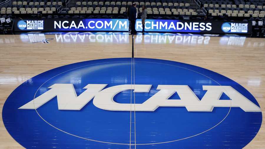 FILE - The NCAA logo is displayed at center court at The Consol Energy Center in Pittsburgh, March 18, 2015. (AP Photo/Keith Srakocic, File)