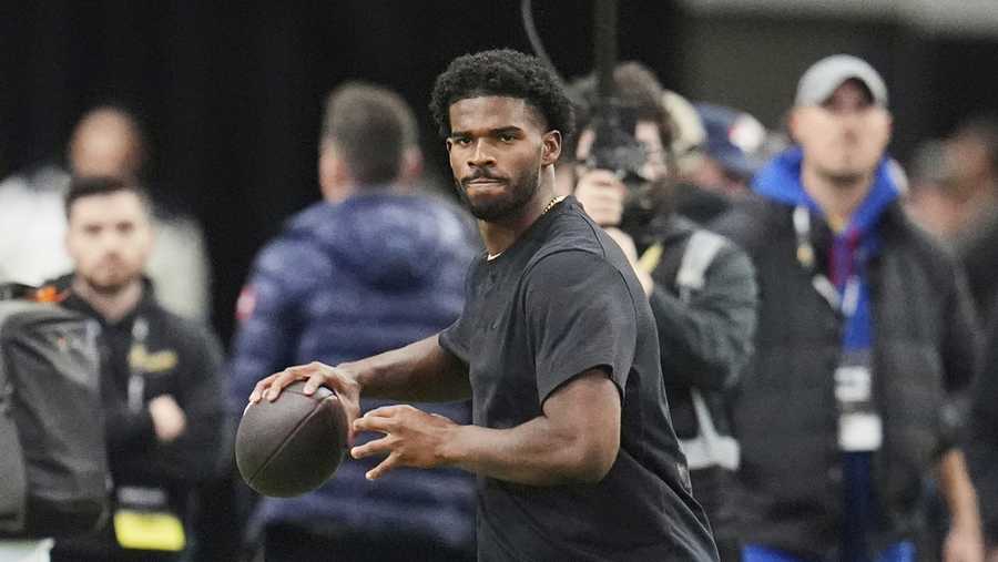 FILE - Colorado quarterback Shedeur Sanders takes part in passing drills during Colorado&apos;s NFL football pro day Friday, April 4, 2025, in Boulder, Colo. (AP Photo/David Zalubowski, File)