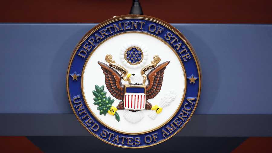 FILE - The seal of the State Department is seen at the Washington Passport Agency, July 12, 2016, in Washington.   (AP Photo/Alex Brandon, File)