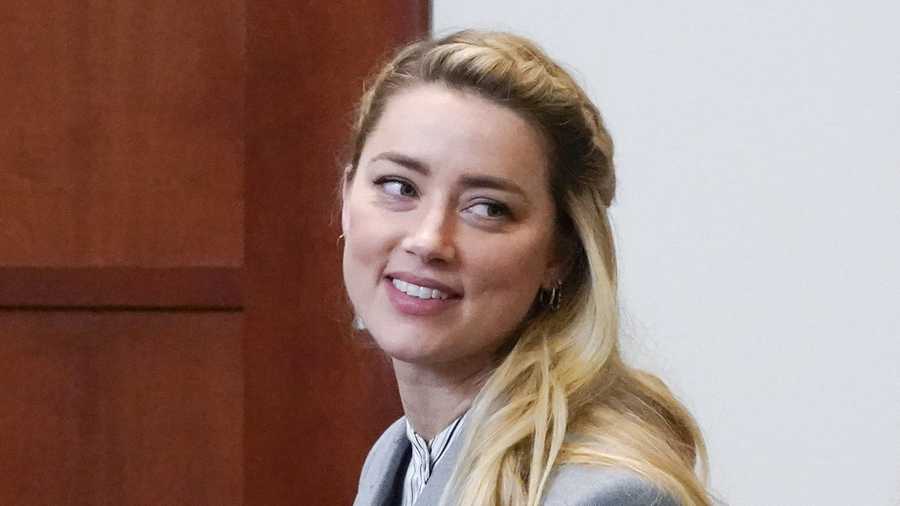 FILE - Actor Amber Heard leaves during a break in the courtroom at the Fairfax County Circuit Courthouse in Fairfax, Va., May 27, 2022. (AP Photo/Steve Helber, Pool, file)
