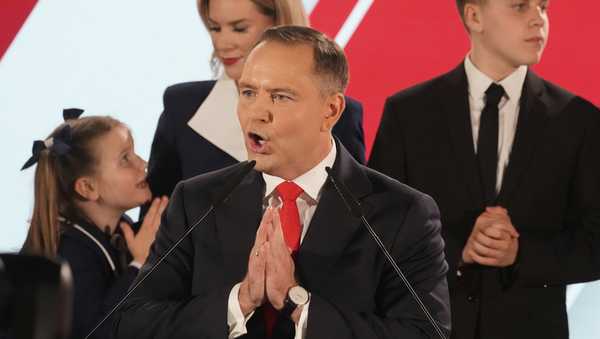Presidential candidate Karol Nawrocki, a conservative historian backed by the right-wing Law and Justice party addresses supporters at his headquarters after the presidential election runoff in Warsaw, Poland, Sunday, June 1, 2025. (AP Photo/Czarek Sokolowski)