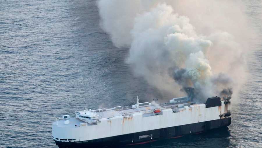 In this photo provided by the U.S. Coast Guard, smoke rises from cargo vessel Morning Midas approximately 300 miles south of Adak, Alaska, June 3, 2025, as the crew of a cargo ship carrying around 3,000 vehicles to Mexico, abandoned ship after they could not control a fire. (U.S. Coast Guard/Courtesy Air Station Kodiak via AP)