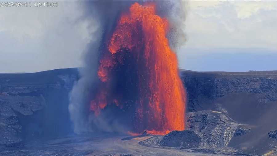 This image from webcam footage provided by the United States Geological Survey (USGS) shows lava fountains shooting up high in the latest episode of an ongoing eruption of Kilauea volcano inside Hawaii Volcanoes National Park on Wednesday, June 11, 2025. (United States Geological Survey via AP)