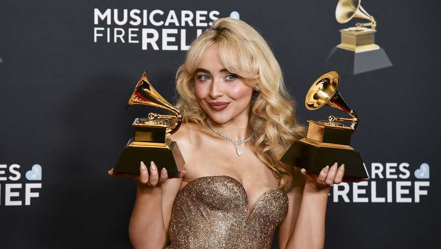 FILE - Sabrina Carpenter poses in the press room with the award for best pop solo performance, and best pop vocal album during the 67th annual Grammy Awards on Feb. 2, 2025, in Los Angeles. (Photo by Richard Shotwell/Invision/AP, File)