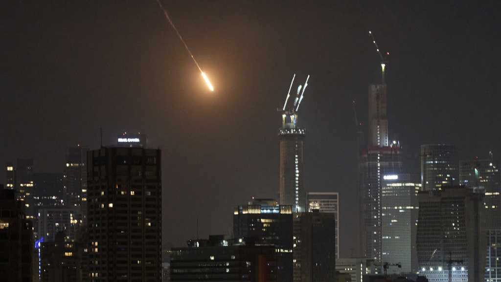 Israel’s defense minister warns 'Tehran will burn' if Iran continues firing missiles