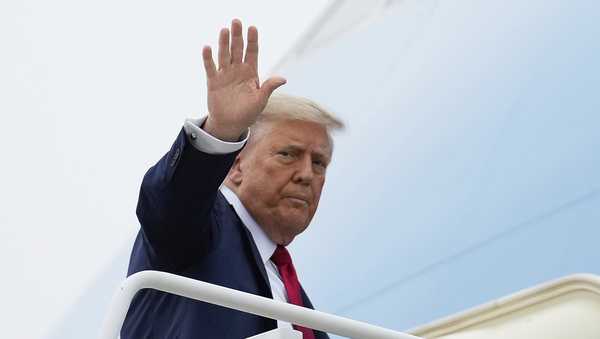 President Donald Trump waves as he boards Air Force One, Sunday, June 15, 2025, at Joint Base Andrews, Md., for a trip to Canada to attend the G7 Summit. (AP Photo/Mark Schiefelbein)