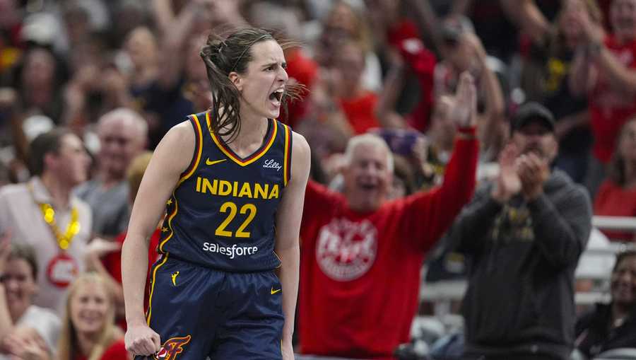 Indiana Fever guard Caitlin Clark (22) celebrates after a three-point basket against the Connecticut Sun in the second half of a WNBA basketball game in Indianapolis, Tuesday, June 17, 2025. (AP Photo/Michael Conroy)