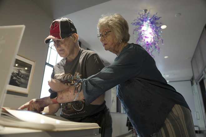 Jacque&#x20;Farnham,&#x20;left,&#x20;looks&#x20;at&#x20;a&#x20;book&#x20;with&#x20;her&#x20;mother,&#x20;Janith,&#x20;in&#x20;the&#x20;Visual&#x20;Arts&#x20;Center&#x20;at&#x20;the&#x20;Washington&#x20;Pavilion&#x20;in&#x20;Sioux&#x20;Falls,&#x20;S.D.,&#x20;on&#x20;May&#x20;20,&#x20;2025.&#x20;&#x28;AP&#x20;Photo&#x2F;Shelby&#x20;Lum&#x29;