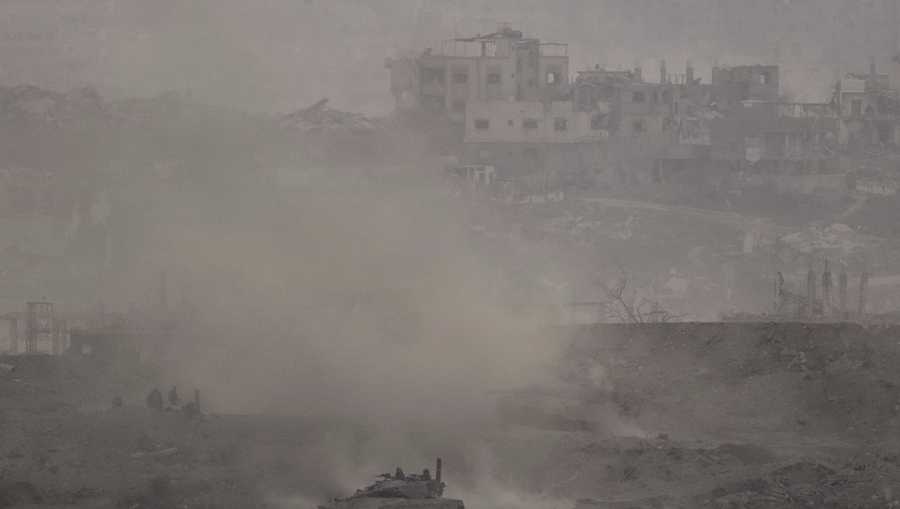 An Israeli army tank advances in the Gaza Strip, as seen from southern Israel on Thursday, July 3, 2025. (AP Photo/Leo Correa)
