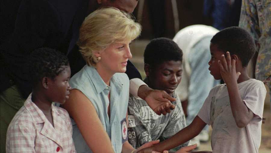 FILE - Diana, Princess of Wales, talks to young Angolan amputees who had their limbs severed by land mines at the the Neves Bendinha Orthopedic Workshop in the outskirts of Luanda, Angola, Jan. 14, 1997. (AP Photo/Giovanni Diffidenti, File)