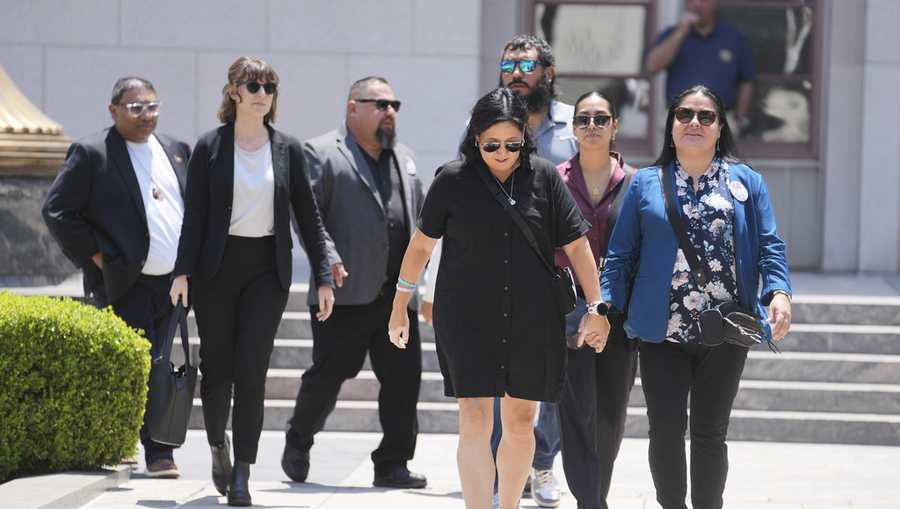 Gloria Cazares, right, holds hands with Veronica Mata during a break in a court hearing in a lawsuit between victims&apos; families in the 2022 Uvalde, Texas school shooting and Meta Platforms on Friday, July 18, 2025, in Los Angeles. (AP Photo/Eric Thayer)