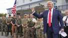 President Donald Trump speaks with members of law enforcement and National Guard soldiers, Thursday, Aug. 21, 2025, in Washington.