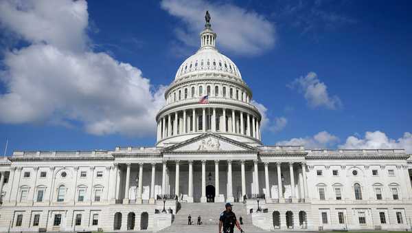 A U.S. Capitol Police officer walks in front of the U.S. Capitol, Aug. 22, 2025, in Washington.