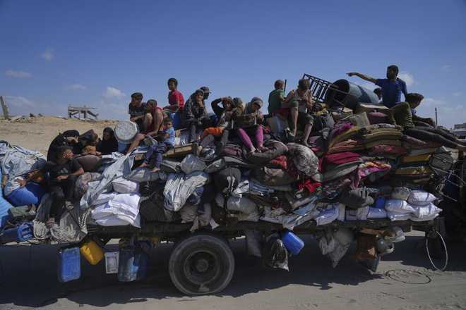 Displaced&#x20;Palestinians&#x20;fleeing&#x20;northern&#x20;Gaza&#x20;carry&#x20;their&#x20;belongings&#x20;along&#x20;the&#x20;coastal&#x20;road&#x20;toward&#x20;southern&#x20;Gaza,&#x20;Tuesday,&#x20;Sept.&#x20;9,&#x20;2025,&#x20;after&#x20;the&#x20;Israeli&#x20;army&#x20;issued&#x20;evacuation&#x20;orders&#x20;from&#x20;Gaza&#x20;City.&#x20;&#x28;AP&#x20;Photo&#x2F;Jehad&#x20;Alshrafi&#x29;