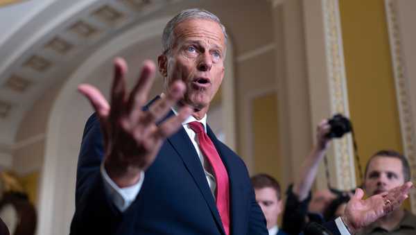 Senate Majority Leader John Thune, R-S.D., gestures while speaking with reporters as the government lurches toward a shutdown at the Capitol in Washington, Tuesday, Sept. 30, 2025. (AP Photo/J. Scott Applewhite)