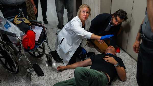 Journalist L. Vural Elibol receives medical assistance after being shoved by federal agents in immigration court on Tuesday, Sept. 30, 2025, in New York. (AP Photo/Olga Fedorova)