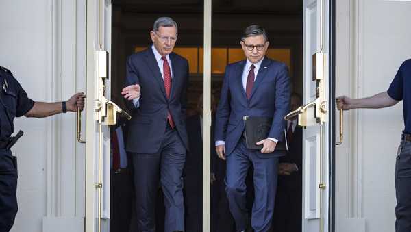Sen. John Barrasso, R-Wyo., the Senate GOP whip, left, and Speaker of the House Mike Johnson, R-La., right, arrive for a news conference with top Republicans on the government shutdown, at the Capitol in Washington, Wednesday, Oct. 1, 2025. (AP Photo/J. Scott Applewhite)
