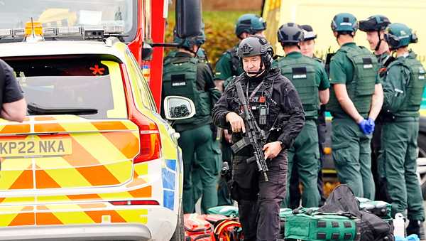An armed police officer at the scene of a stabbing incident at Heaton Park Hebrew Congregation synagogue, in Crumpsall, Manchester, England, Thursday Oct. 2, 2025.