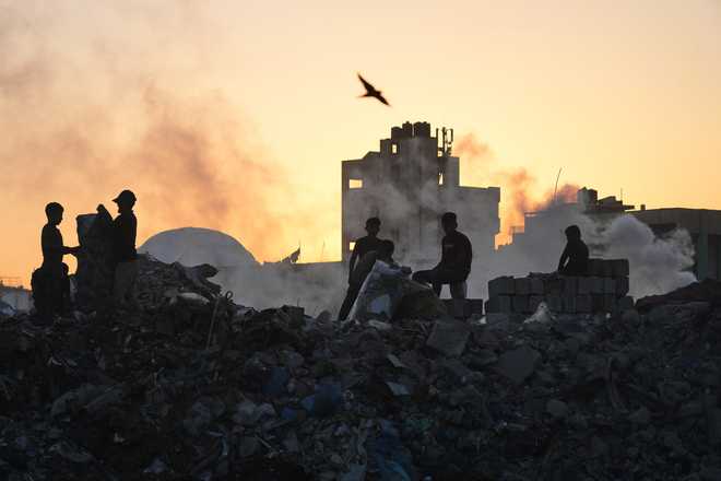 Palestinians&#x20;search&#x20;for&#x20;firewood&#x20;and&#x20;plastic&#x20;at&#x20;a&#x20;landfill&#x20;in&#x20;Gaza&#x20;City&#x20;Saturday,&#x20;Oct.&#x20;25,&#x20;2025.&#x20;&#x28;AP&#x20;Photo&#x2F;Abdel&#x20;Kareem&#x20;Hana&#x29;