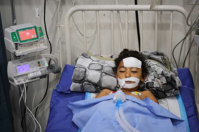 Nabila&#x20;Shorbasi,&#x20;who&#x20;was&#x20;injured&#x20;by&#x20;an&#x20;unexploded&#x20;ordnance&#x20;along&#x20;with&#x20;her&#x20;six-year-old&#x20;twin&#x20;brother&#x20;Yahya,&#x20;lies&#x20;on&#x20;a&#x20;bed&#x20;at&#x20;Patient&amp;apos&#x3B;s&#x20;Friends&#x20;Charity&#x20;Hospital&#x20;in&#x20;Gaza&#x20;City,&#x20;Saturday,&#x20;Oct.&#x20;25,&#x20;2025.&#x20;&#x28;AP&#x20;Photo&#x2F;Abdel&#x20;Kareem&#x20;Hana&#x29;