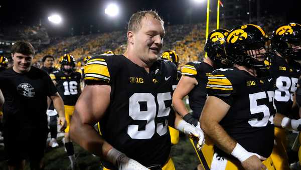 FILE - Iowa defensive lineman Aaron Graves (95) celebrates after an NCAA college football game against Penn State, Oct. 18, 2025, in Iowa City, Iowa. (AP Photo/Charlie Neibergall, File)
