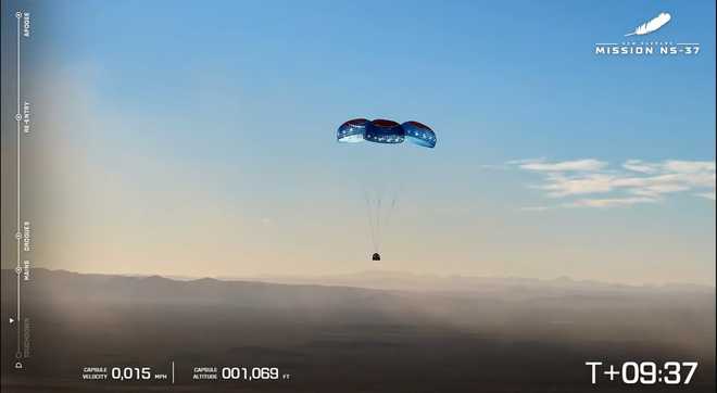 This image provided by Blue Origin, parachutes deploy to carry the Blue Origin's capsule to the ground after liftoff on Saturday, Dec. 20, 2025 in West Texas.  (Blue Origin via AP)