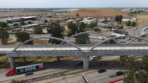FILE - The Cedar Viaduct, designed to take high-speed trains over Cedar and North avenues and State Route 99, is shown in an aerial view, Tuesday, April 15, 2025, in Fresno, Calif. (AP Photo/Godofredo A. Vásquez, File)