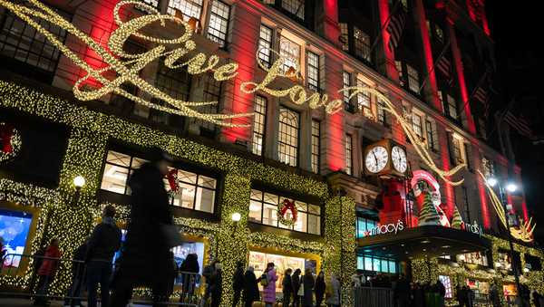 FILE - Shoppers wait in line to enter Macy's flagship store on Nov. 28, 2025 in New York. (AP Photo/Angelina Katsanis, File)