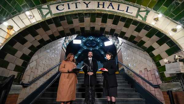 New York Attorney General Letitia James, left, administers the oath of office to mayor-elect Zohran Mamdani, center, as his wife Rama Duwaji looks on, Thursday, Jan. 1, 2026, in New York. (AP Photo/Yuki Iwamura)
