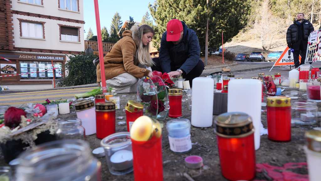 Swiss investigators believe sparkling flares atop champagne bottles ignited fatal bar fire