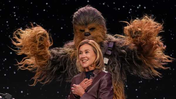 LEGO chief product and marketing officer and executive vice president Julia Goldin talks as a a Chewbacca stands behind her during an LEGO news conference ahead of the CES tech show Monday, Jan. 5, 2026, in Las Vegas. (AP Photo/Abbie Parr)