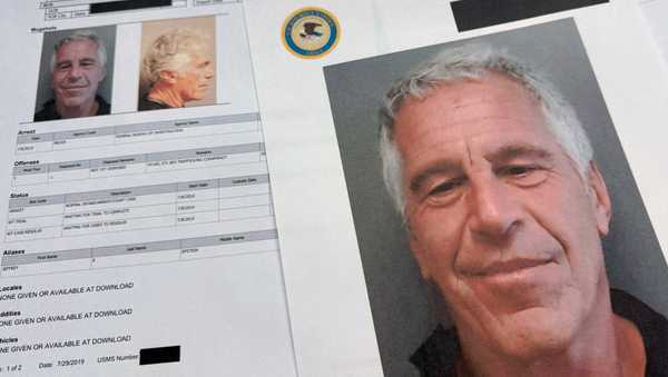 Documents that were included in the U.S. Department of Justice release of the Jeffrey Epstein files are photographed Friday, Jan. 2, 2026. (AP Photo/Jon Elswick)
