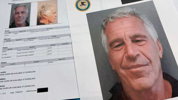 FILE - Documents that were included in the U.S. Department of Justice release of the Jeffrey Epstein files are photographed Friday, Jan. 2, 2026. (AP Photo/Jon Elswick, File)