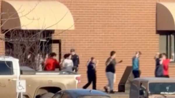 This grab from video shows students exiting the Tumbler Ridge school after deadly shootings, in British Columbia, Canada, Tuesday Feb. 10, 2026.