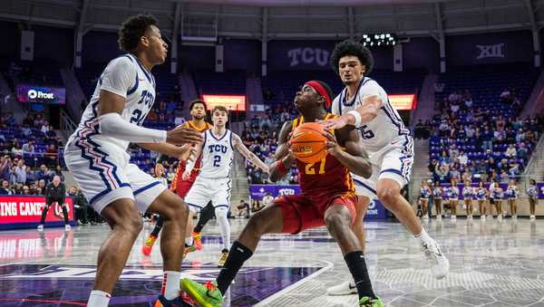 Iowa State guard Killyan Toure (27) goes to shoot the ball as TCU forward David Punch (15) reaches over during an NCAA college basketball game,, Tuesday, Feb. 10, 2026, Fort Worth, Texas. (AP Photo/Jessica Tobias)